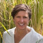 Pamela Ronald in a rice field