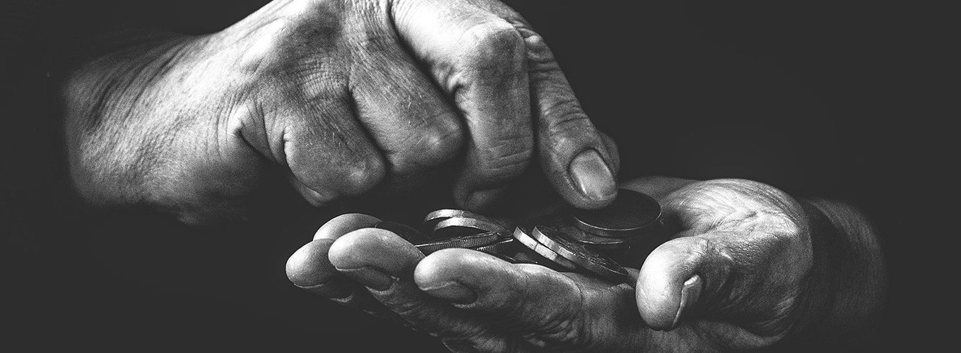 photo of hands holding coins