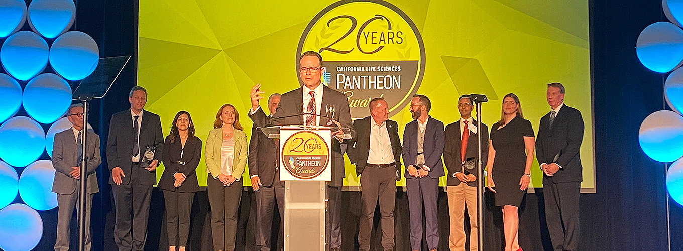 Photo of individuals standing on stage at the 2023 Pantheon Awards