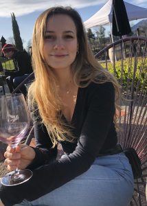 Kelsey Hern drinking wine in Napa
