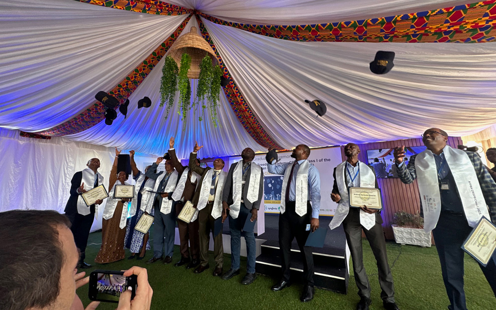 Students from the CRISPR course in Kenya celebrating graduation by throwing their hats in the air