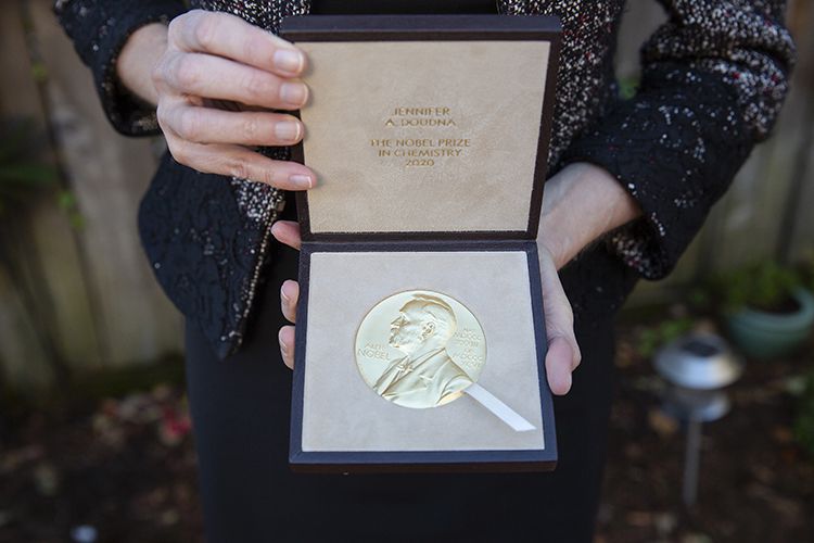 Closeup of Jennifer Doudna displaying the Nobel Prize medal in its case