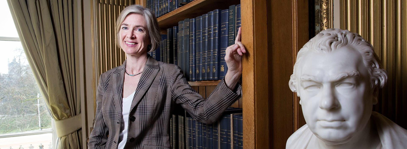 Jennifer Doudna next to a statue of Sir Joseph Banks