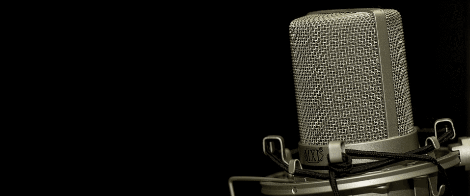 Silver microphone in front of black background