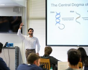 Scientist Michael Gomez giving a presentation in a classroom