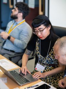 Marena Trinidad working at the IGI & EECS hackathon