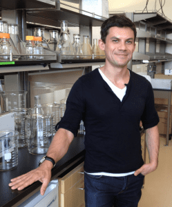 Professor Roberto Zoncu standing by a lab bench