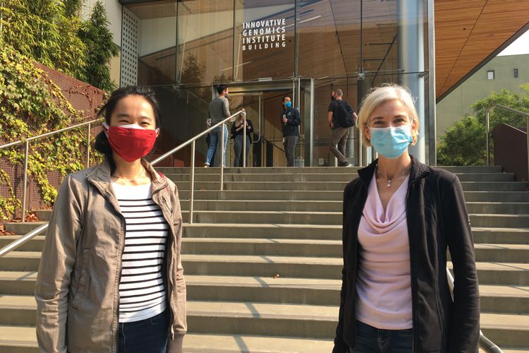 Tina Liu and Jennifer Doudna, in masks, outside of the IGI building