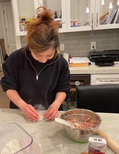 Yue Clare Lou making dumplings