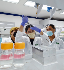 Southeast Asian women in a lab pipetting