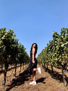 Yue Clare Lou in the vineyards, enjoying a day out wine tasting 