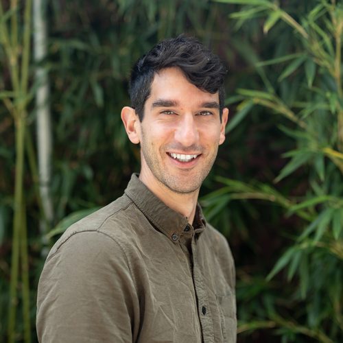 Noam Prywes in front of bamboo outside the IGI building in Berkeley