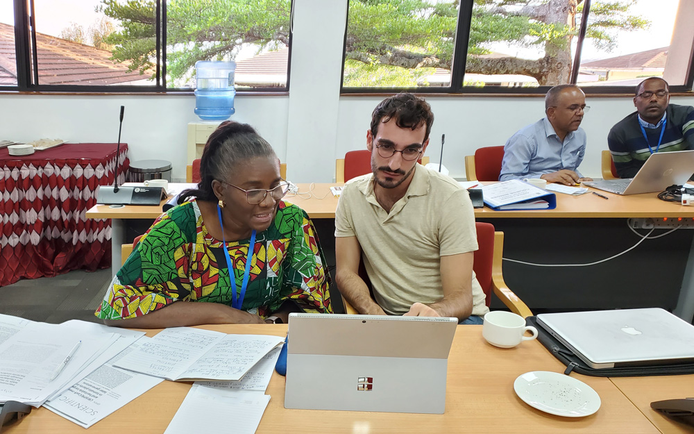 Kenya Course participants and instructors working together at computers